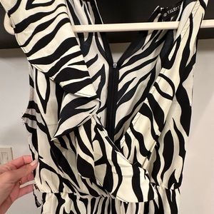 Wide leg- very comfy. Used it only once. You just need a good belt with it.